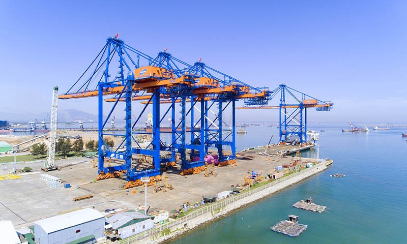 These cranes have a reach of 24 + 2 container rows. From the shore, the crane can reach 70m out to the sea
