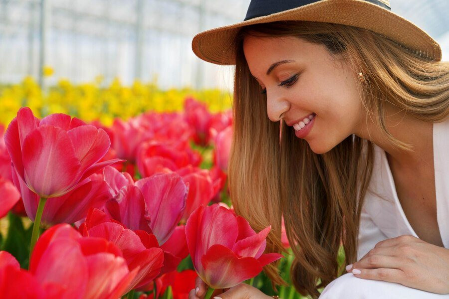 happy-beauty-girl-with-straw-hat-smelling-blooming-tulips-farm-ready-be-harvested_63239-4677.jpeg