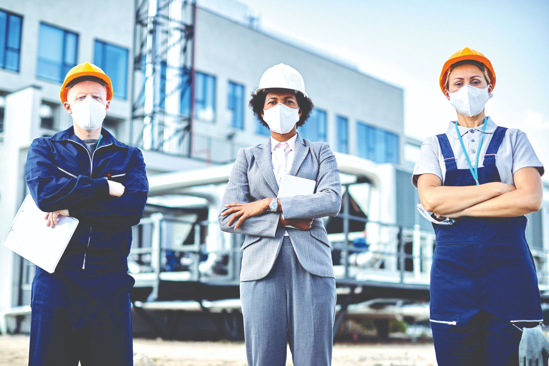team-confident-civil-engineers-with-protective-face-masks-construction-site-compressed.jpg