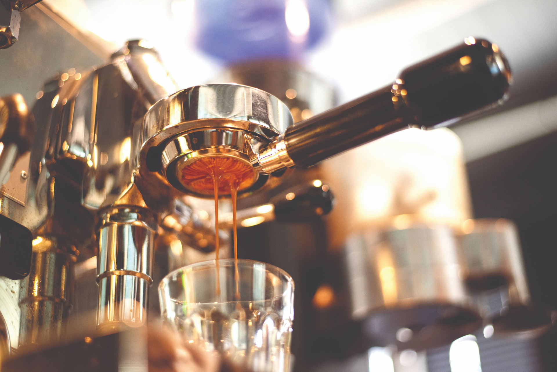 close-up-coffee-machine-is-preparing-coffee-coffee-shop-compressed.jpg