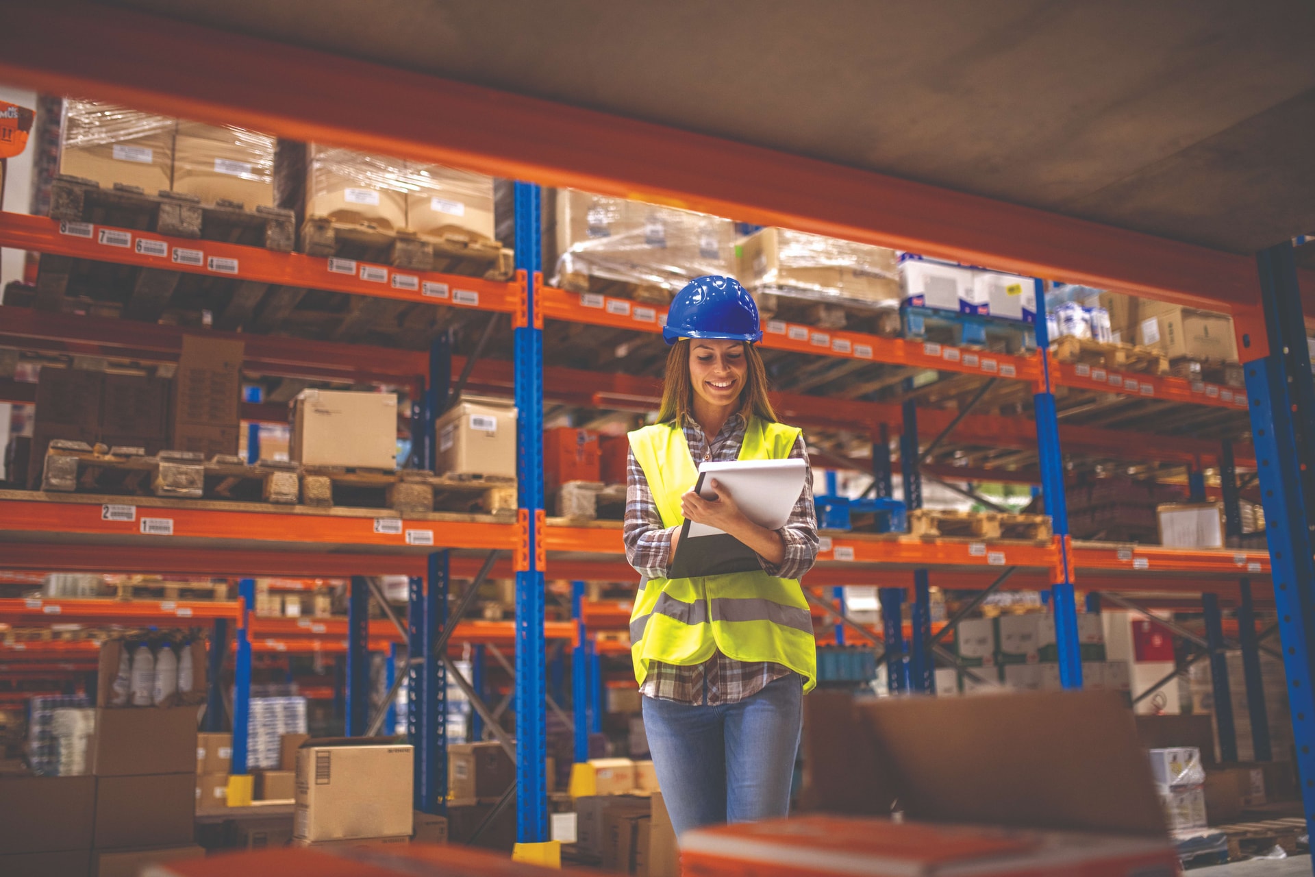 warehouse-female-worker-checking-inventory-distribution-warehouse-compressed-1-.jpg