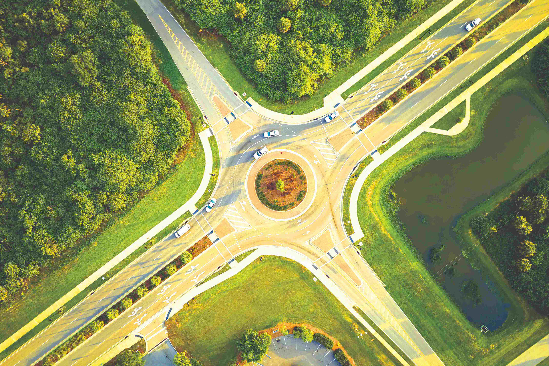 aerial-view-road-roundabout-intersection-with-moving-cars-traffic-rural-circular-transportation-crossroads-compressed.jpg
