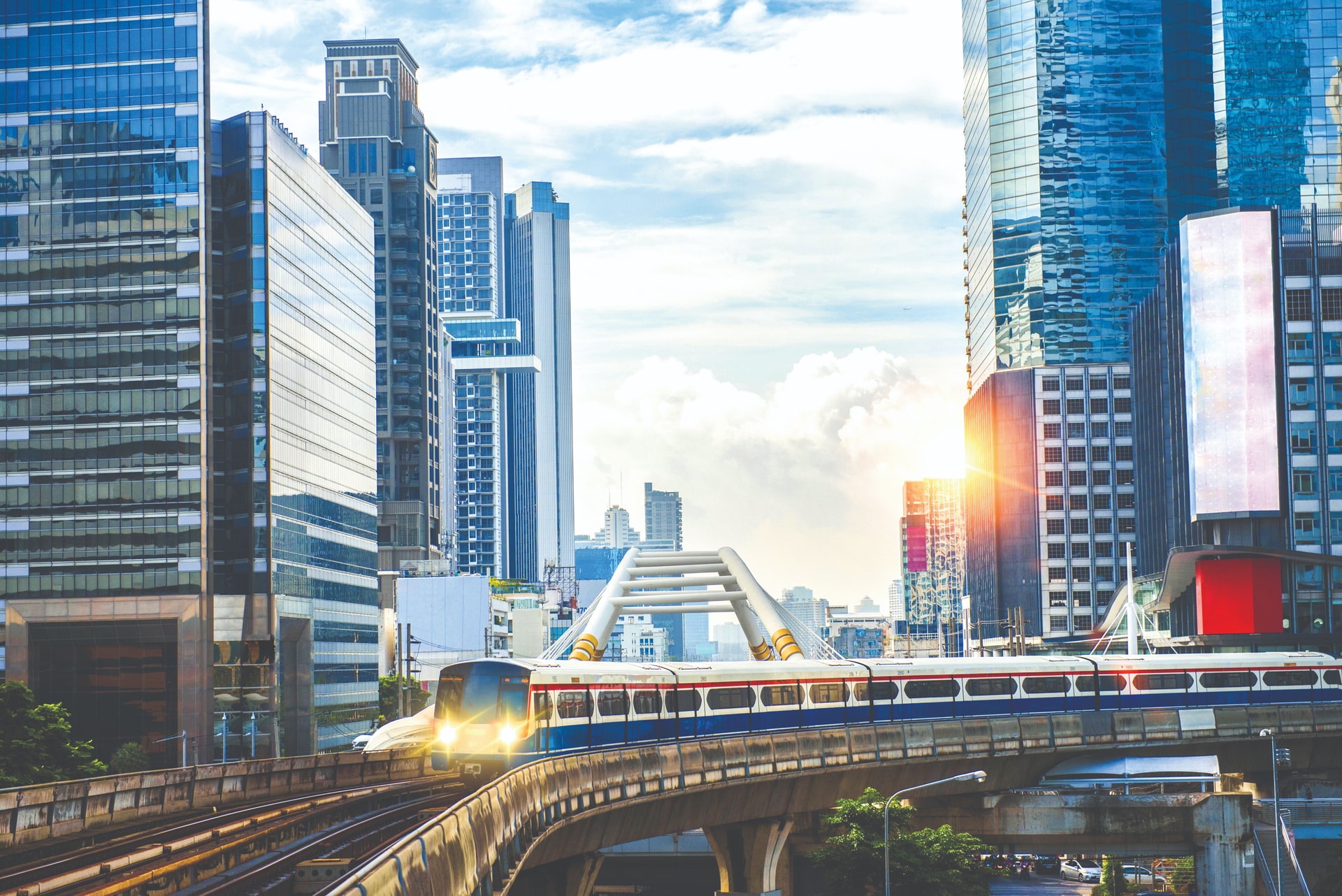 bts-skytrain-electric-train-running-way-with-business-office-buildings-background-compressed.jpg