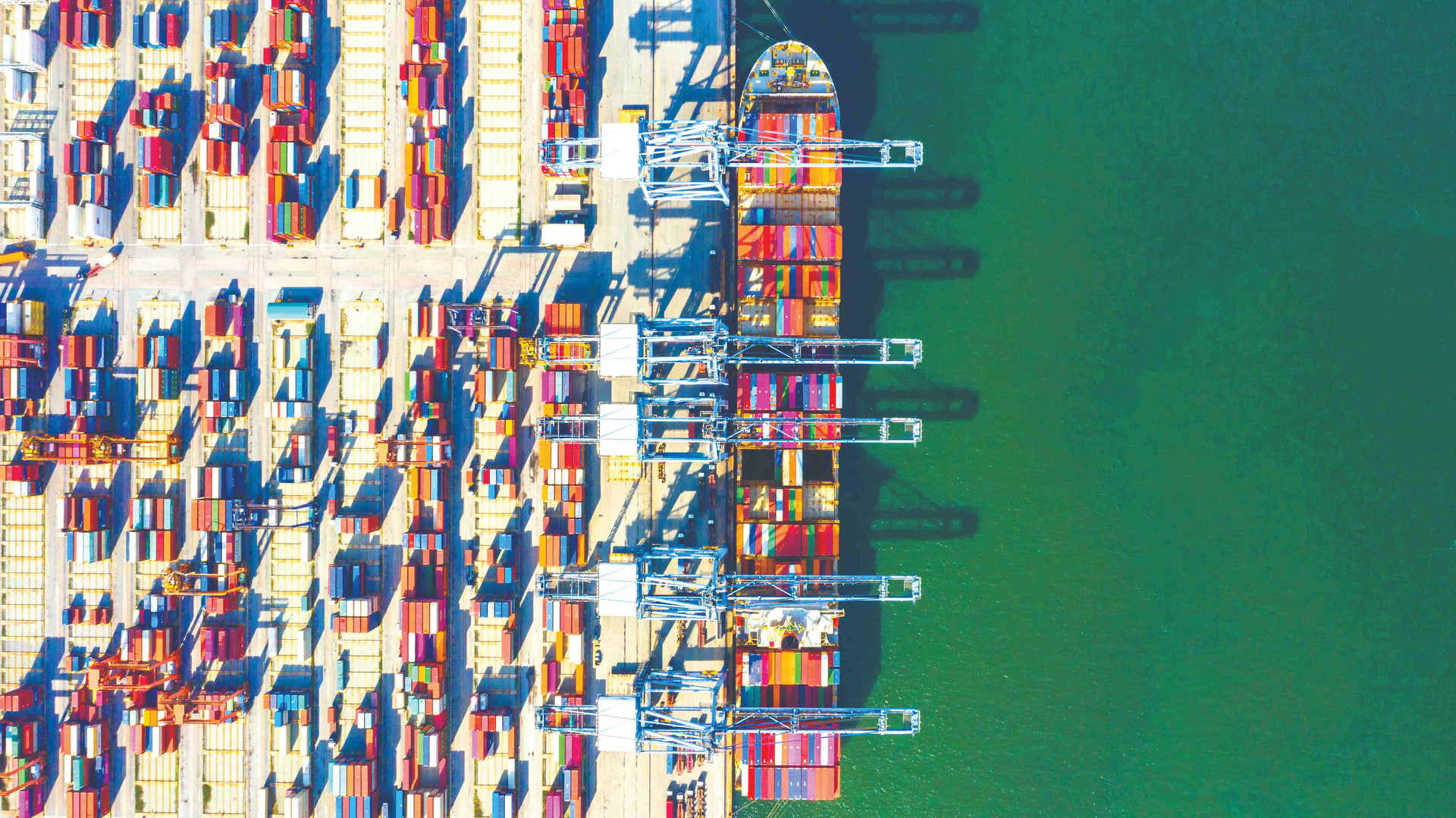 container-ship-loading-unloading-deep-sea-port-aerial-top-view-business-logistic-import-export-freight-transportation-compressed(1).jpg