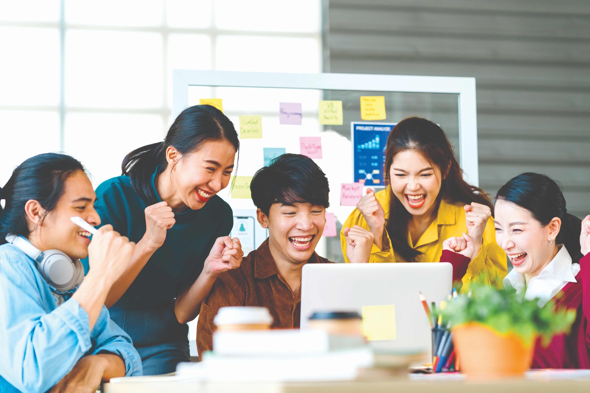 group-asia-young-creative-people-smart-casual-wear-discussing-business-celebrate-giving-five-after-dealing-feeling-happy-signing-contract-agreement-office-coworker-teamwork-concept-compressed.jpg