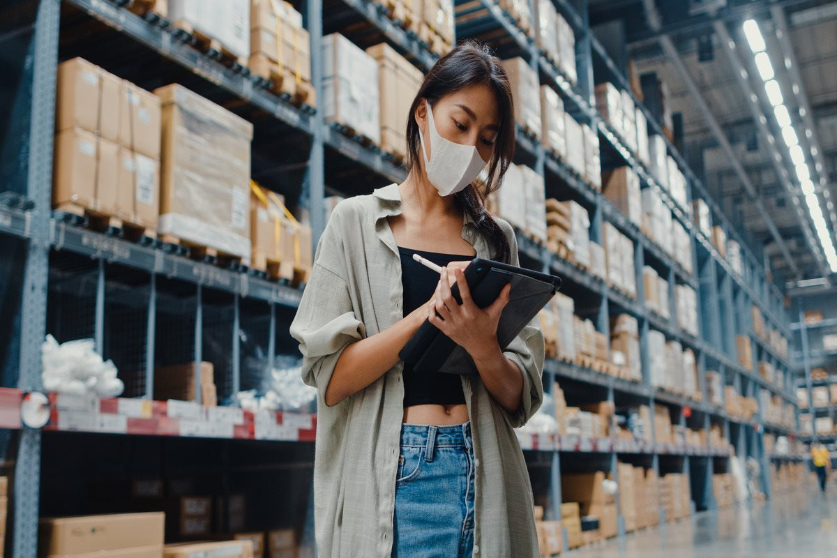 young-asian-businesswoman-manager-wearing-face-mask-warehouse-using-digital-tablet-checking-inventory-1-.jpg