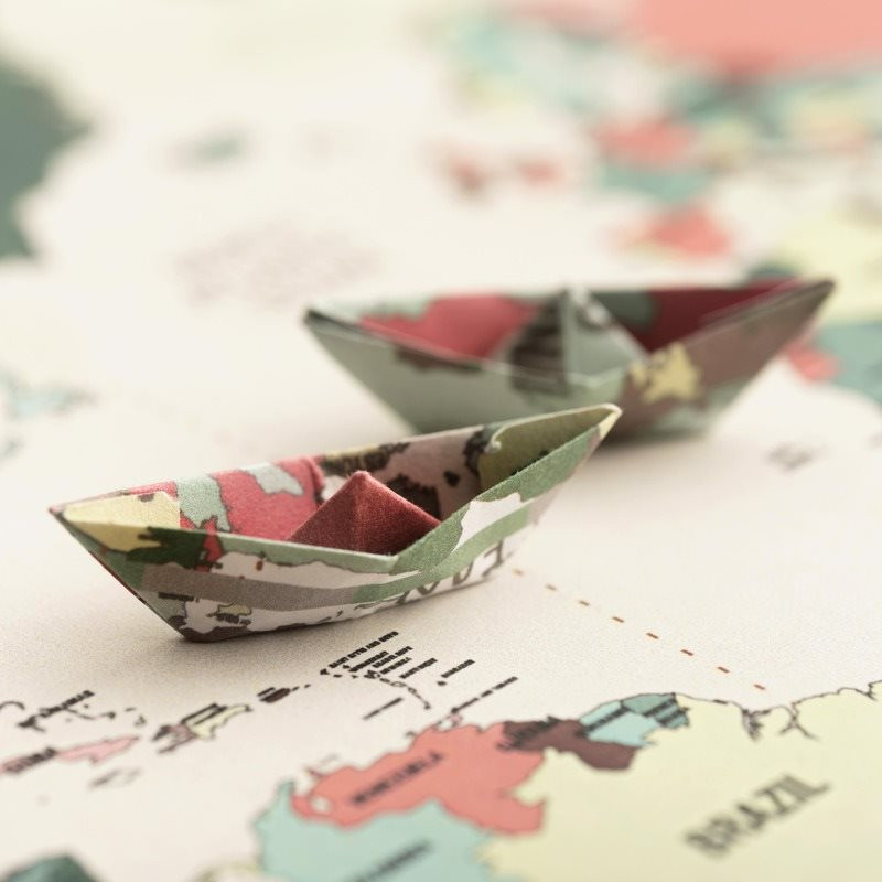 small-origami-boat-world-map-high-angle-1-.jpg