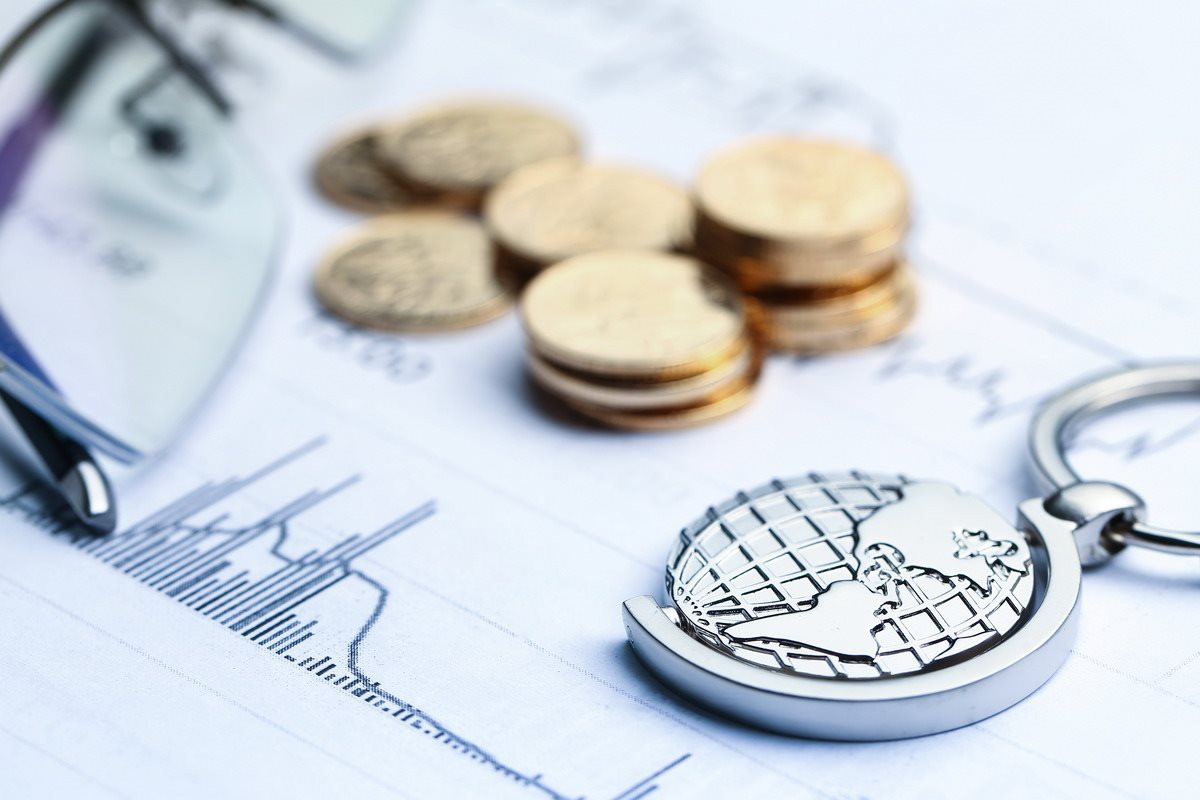 coins-paper-money-globe-white-statistic-form-background-1-.jpg