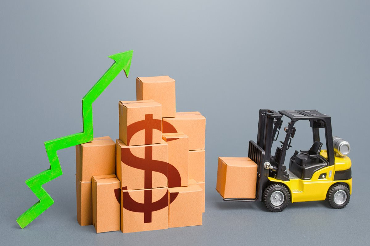 forklift-near-stack-dollar-boxes-with-green-up-arrow-sales-growth-concept-production-1-.jpg