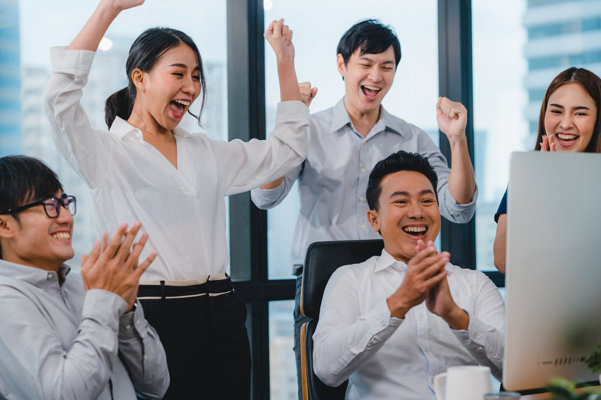 millennial-group-young-businesspeople-asia-businessman-businesswoman-celebrate-giving-five-after-dealing-feeling-happy-signing-contract-agreement-meeting-room-small-modern-office-1-.jpg