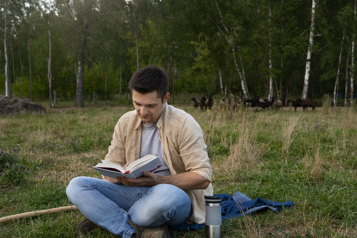 man-reading-outdoors-full-shot-1-.jpg