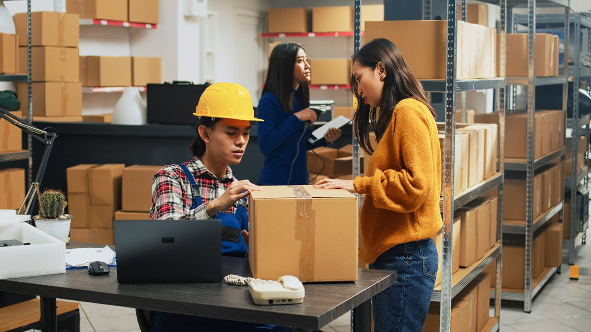 team-young-workers-analyzing-stack-products-before-planning-distribution-budgeting-people-checking-quality-merchandise-boxes-supply-chain-management-warehouse-1-.jpg