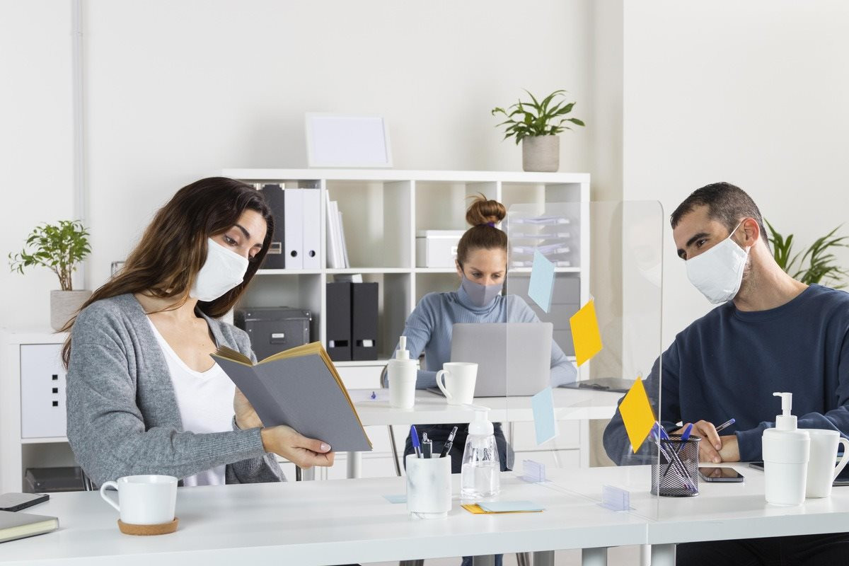 medium-shot-coworkers-wearing-masks-1-.jpg