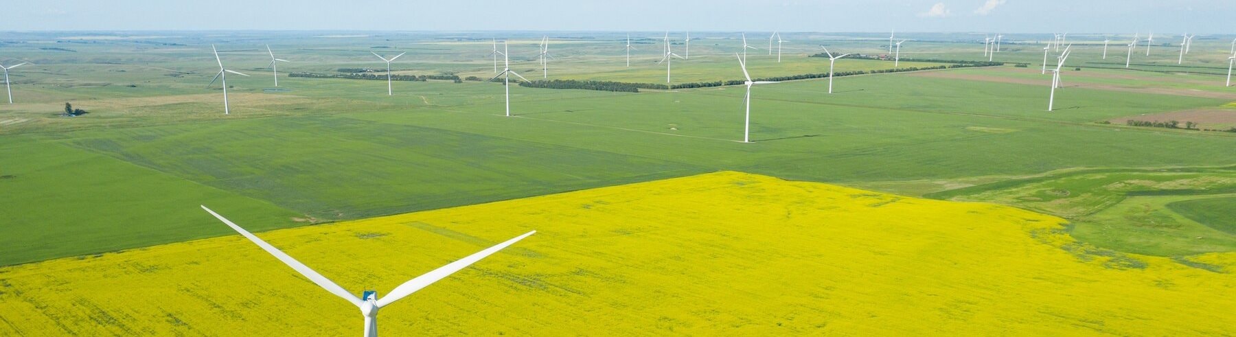 aerial-shot-wind-generator-large-field-daytime_181624-30812.jpg