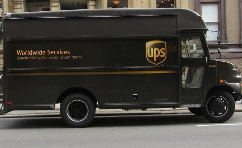 Transport costs, higher spending hit UPS profit